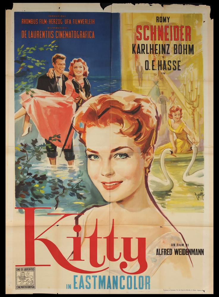 L'immagine riproduce uno dei manifesti conservati presso la Mediateca Regionale Pugliese (vedi Note). Si tratta del manifesto del film "Kitty", a firma di Carloantonio Longi. L'impostazione grafica del manifesto mette in risalto la figura femminile, con lo splendido ritratto dell'attrice Romy Schneider in una composizione elegante e dai toni caldi. Il forte realismo dei volti è una caratteristica del pittore, che iniziò la carriera artistica come ritrattista per poi dedicarsi all'attività di illustratore e cartellonista cinematografico per circa 20 anni, firmando molte opere per i più noti film dell'epoca, fino alla sua morte, avvenuta prematuramente all'età di 59 anni. Della sua attività di cartellonista si conservano però un cospicuo numero di lavori, tavole e bozzett...