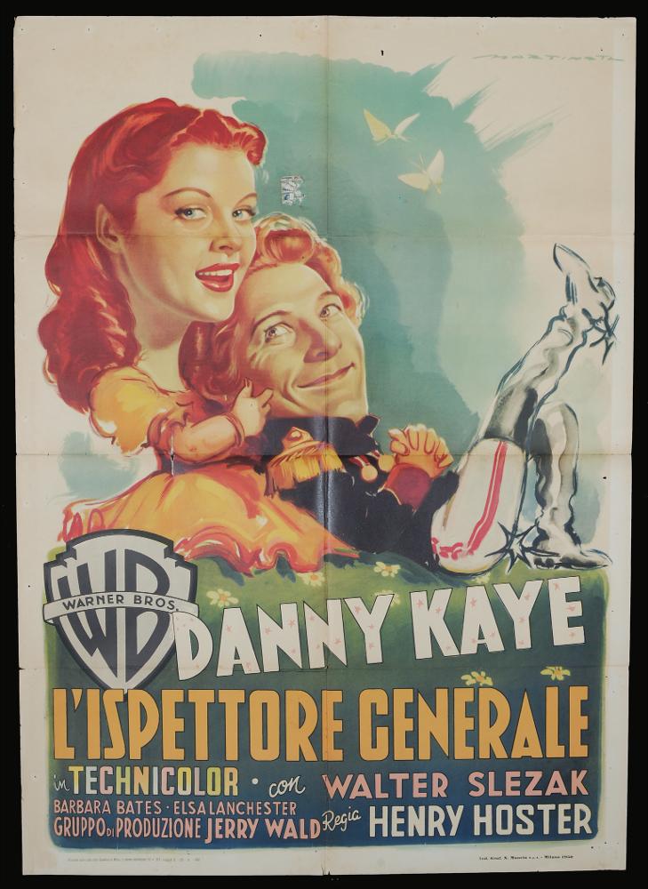 L'immagine riproduce uno dei manifesti conservati presso la Mediateca Regionale Pugliese (vedi Note). Si tratta di una delle versioni grafiche per il manifesto del film "L’ispettore generale" del 1949 per la regia di Henry Koster e basata sull’omonima opera teatrale di Nikolaj Gogol’ del 1836. La firma che si legge in alto a destra è dell’illustratore Luigi Martinati, toscano di nascita, da considerarsi uno degli interpreti della prima maniera del manifesto di cinema. Possiamo osservare alcuni degli elementi che contraddistinguono lo stile del pittore come i giochi di contrasto con colori netti, la rappresentazione di grandi volti, in questo caso addirittura sproporzionati rispetto ai corpi degli stessi personaggi. Sembra che Martinati abbia voluto proporci i personaggi...