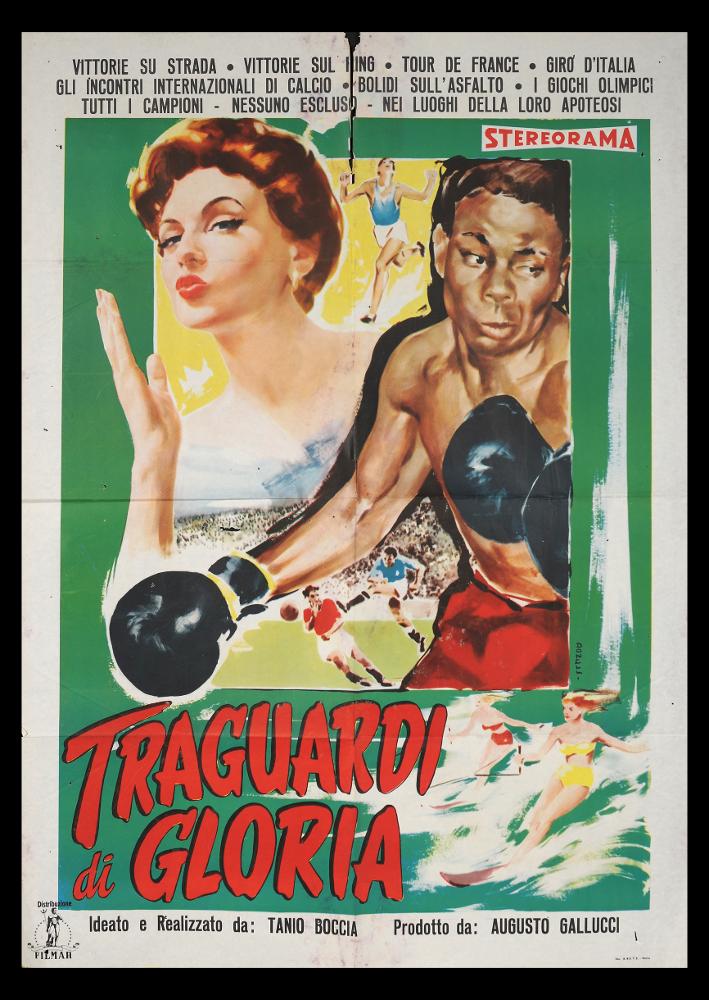 L'immagine riproduce uno dei manifesti conservati presso la Mediateca Regionale Pugliese (vedi Note). Si tratta di una delle versioni grafiche del manifesto del film italiano "Traguardi di Gloria". L'illustratore del manifesto, l'artista Donelli, realizza una composizione di grande effetto scenico, basata su toni di colore accesi e con zone delimitate da linee che evidenziano ogni figura: la splendida donna che esce dalla cornice e il pugile delineato da un'ombra nera. Donelli dimostra anche in altri manifesti, qui in collezione, la sua modernità artistica e compositiva, ricca di linee grafiche molto rapide ed elementi significativi dal forte impatto comunicativo. ...