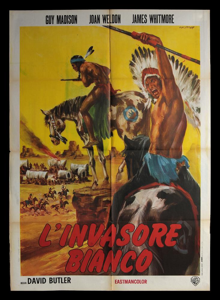 L'immagine riproduce uno dei manifesti conservati presso la Mediateca Regionale Pugliese (vedi Note). Si tratta di uno dei manifesti del film “L’invasore bianco” del 1954 per la regia di Roy Del Ruth. La firma che si legge è dell’illustratore G. Di Stefano, autore di molte altre locandine e manifesti che hanno come protagonista Maciste, l’eroe forzuto inventato da Gabriele d’Annunzio o i pellerossa. La composizione grafica in oggetto è di grande impatto visivo sia per la rappresentazione delle due grandi figure a cavallo in primo piano, sia per la scelta di utilizzare il colore giallo su tutto lo sfondo. L’indiano in primo piano sembra incitare alla battaglia direttamente il pubblico, infatti Di Stefano lo pone di spalle ma con il viso rivolto verso lo spettatore....