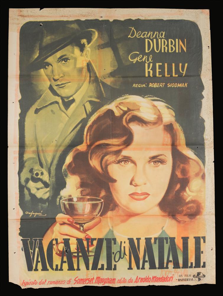 L'immagine riproduce uno dei manifesti conservati presso la Mediateca Regionale Pugliese (vedi Note). Si tratta di uno dei manifesti del film in bianco e nero “Vacanze a Natale” del 1944 per la regia di Robert Siodmak. La firma che si legge è dell’illustratore romano Carfagni Federico (Carfagni), attivo sicuramente a partire almeno dagli anni Quaranta. Si dedicò al cartellonismo nell’immediato dopoguerra divenendo uno dei maggiori disegnatori di cartelloni pubblicitari e per il cinema americano in Italia. In questa composizione Carfagni dà spazio alla rappresentazione dei due protagonisti, esaltandone i volti, i primi piani. Colpisce l’uso del doppio colore, sullo sfondo un monocromo scuro per rappresentare Gene Kelly, scelta che fa intendere allo spettatore uno stato d...