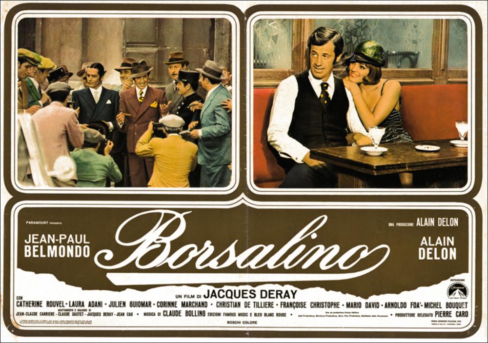 L'immagine digitale in oggetto è scansione della fotobusta originale del film "Borsalino", elaborata in occasione della mostra "Riccardo Cucciolla - Ritratto d'Attore" organizzata nel 2012 dall'Associazione culturale “Attraverso lo Spettacolo”, dall'Assessorato al Mediterraneo, Cultura e Turismo della Regione Puglia e dal Servizio Biblioteca e Comunicazione Istituzionale del Consiglio Regionale della Puglia. L'opera, dai toni caldi e raffinati, è divisa in tre riquadri: due superiori che includono scene tratte dal film e una inferiore che mette insieme il titolo e i nomi degli attori. Il film, diretto da Jacques Deray e prodotto da Alain Delon, esce nelle sale italiane nel 1970. Tratta dal romanzo francese “Bandits à Marseille” di Eugène Saccomanno, la pellicola, ambien...