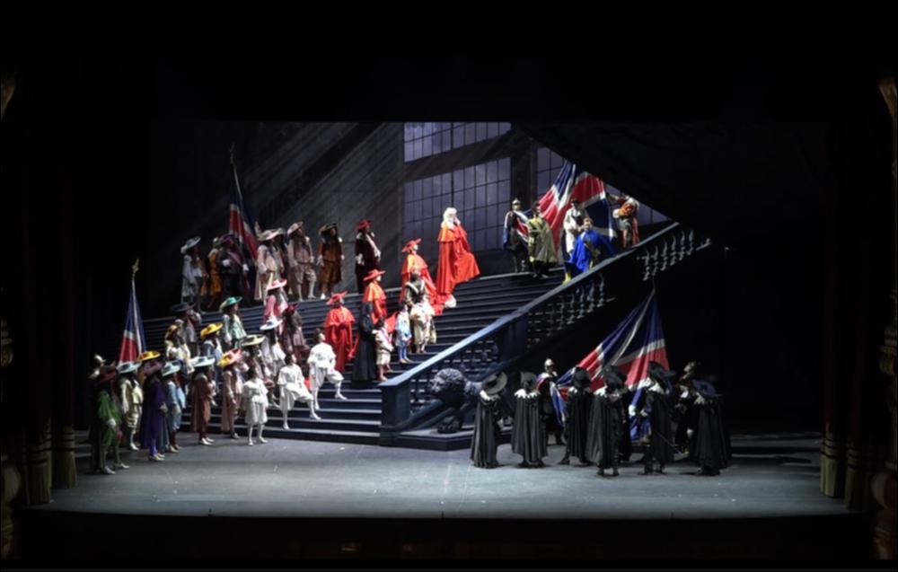 Per la Stagione d’Opera 2020, la Fondazione Petruzzelli ha portato in scena “Un ballo in maschera” di Giuseppe Verdi (1858), per la regia, scene e costumi di Massimo Gasparon.
Il testo è tratto da Gustave III, ou Le Bal Masqué di Eugène Scribe. Il grande capolavoro verdiano andò in scena per la prima volta il 17 febbraio 1859 presso il Teatro Apollo di Roma.
Lo spettacolo è una storica e bellissima produzione della Fondazione Teatro Regio di Parma, capolavoro che fu rappresentato al Petruzzelli per la prima volta nel dicembre 1906.
“Un ballo in maschera” è tra le più complesse delle opere verdiane perché, pur essendo in parte tragedia e in parte commedia, riesce a trasmettere un senso di raffinata compiutezza.
Nella Boston del XVII secolo, il giovane Conte Riccardo, gov...