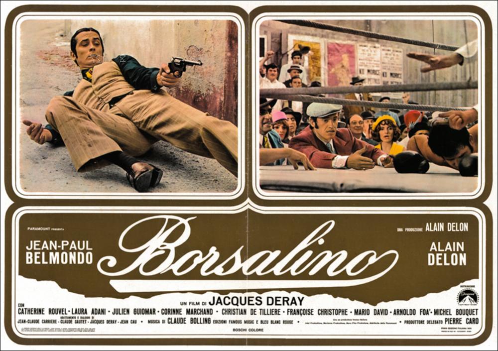 L'immagine digitale in oggetto è scansione della fotobusta originale del film "Borsalino", elaborata in occasione della mostra "Riccardo Cucciolla - Ritratto d'Attore" organizzata nel 2012 dall'Associazione culturale “Attraverso lo Spettacolo”, dall'Assessorato al Mediterraneo, Cultura e Turismo della Regione Puglia e dal Servizio Biblioteca e Comunicazione Istituzionale del Consiglio Regionale della Puglia. L'opera, dai toni caldi e raffinati, è divisa in tre riquadri: due superiori che includono scene tratte dal film e una inferiore che mette insieme il titolo e i nomi degli attori. Il film, diretto da Jacques Deray e prodotto da Alain Delon, esce nelle sale italiane nel 1970. Tratta dal romanzo francese “Bandits à Marseille” di Eugène Saccomanno, la pellicola, ambien...