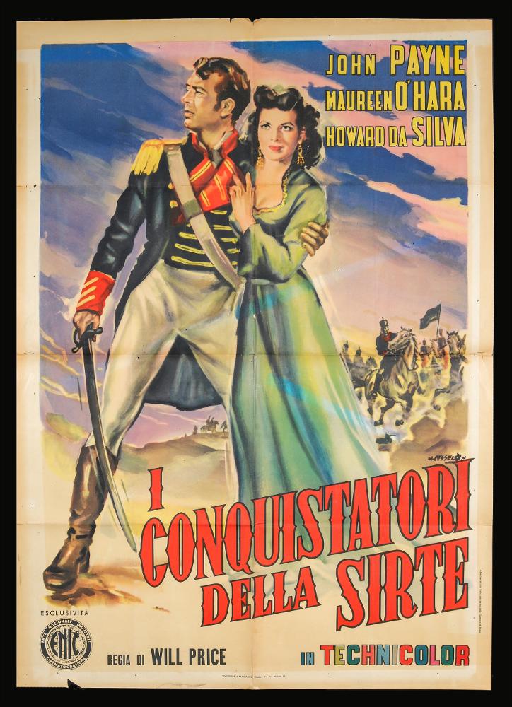 L'immagine riproduce uno dei manifesti conservati presso la Mediateca Regionale Pugliese (vedi Note). Si tratta di una delle due versioni grafiche del manifesto del film americano "I conquistatori della Sirte". L'illustrazione pittorica è a firma di Angelo Cesselon, considerato uno dei pittori di cinema più originali, contraddistinto da uno stile fatto di un cromatismo vibrante e dinamico. Nei suoi lavori per il grande schermo, ha sempre prediletto l'uso di tocchi sfumati e leggeri, con contrasti di colore forti e contemporanei. Ma è indubbio che Cesselon fu influenzato anche da una certa tradizione pittorica veneta, che guarda ad artisti come Tiziano e Tiepolo, fino a Giovanni Boldini, soprattutto nelle composizioni diagonali. Tutta la sua produzione, anche quella più ...