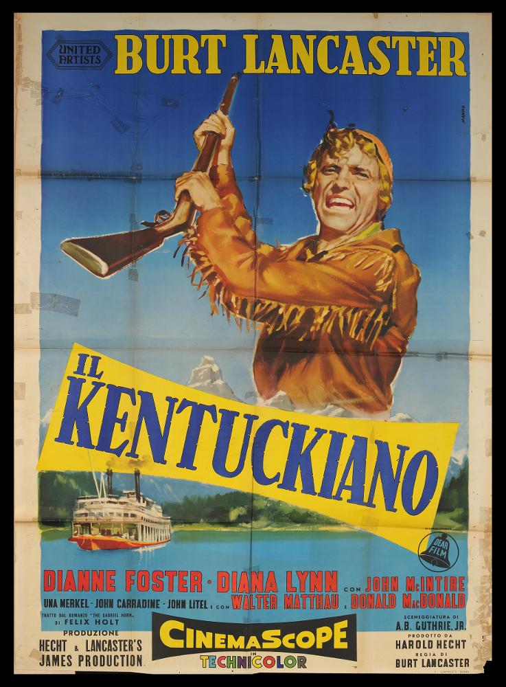 L'immagine riproduce uno dei manifesti conservati presso la Mediateca Regionale Pugliese (vedi Note). Si tratta di una delle versioni grafiche del manifesto del film "Il kentuckiano", a firma di Manno (Dante Manno). L'impostazione monumentale è tipica del pittore romano, formatosi all'Accademia di Belle Arti, dove fu allievo di Duilio Cambellotti, grande artista e pittore di cinema. Questo influenzerà la sua carriera, dedicandosi totalmente alla pittura di cinema, sua grande passione fino alla crisi degli anni '70. L'uso degli acquerelli e della tempera, di colori compatti e pastosi rendono le sue figure ben definite e morbide, unendo un certo stile classico e accademico ad una grafica moderna. Manno, come molti altri pittori dell'epoca dediti alla pittura per manifesti...