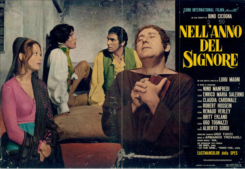 L'immagine digitale è la riproduzione fotografica del manifesto cinematografico del film “Nell'anno del Signore” elaborata in occasione della mostra "Cinema 150 anni. Mostra di manifesti cinematografici d'epoca sul Risorgimento". La mostra, allestita negli spazi della Mediateca Regionale di Bari, è stata realizzata nel 2011 dall'Ufficio Attività culturali e audiovisivi, afferente al Servizio Cultura e Spettacolo della Regione Puglia, in occasione delle celebrazioni dei 150 anni dell'Unità d'Italia. L'autore della fotobusta sceglie di realizzare il fotomontaggio di una delle scene centrali del film: i due carbonari imprigionati a Castel Sant'Angelo ricevono la visita di un frate, interpretato da Alberto Sordi, che cerca in tutti i modi di farli confessare per salvare le ...