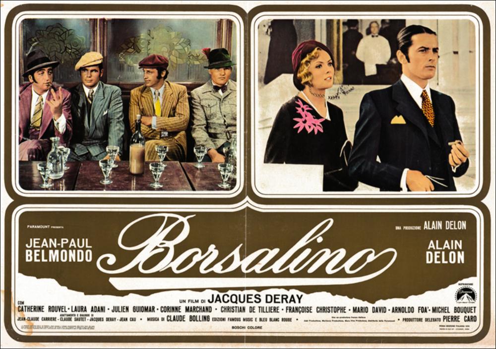 L'immagine digitale in oggetto è scansione della fotobusta originale del film "Borsalino", elaborata in occasione della mostra "Riccardo Cucciolla - Ritratto d'Attore" organizzata nel 2012 dall'Associazione culturale “Attraverso lo Spettacolo”, dall'Assessorato al Mediterraneo, Cultura e Turismo della Regione Puglia e dal Servizio Biblioteca e Comunicazione Istituzionale del Consiglio Regionale della Puglia. L'opera, dai toni caldi e raffinati, è divisa in tre riquadri: due superiori che includono scene tratte dal film e una inferiore che mette insieme il titolo e i nomi degli attori. Il film, diretto da Jacques Deray e prodotto da Alain Delon, esce nelle sale italiane nel 1970. Tratta dal romanzo francese “Bandits à Marseille” di Eugène Saccomanno, la pellicola, ambien...