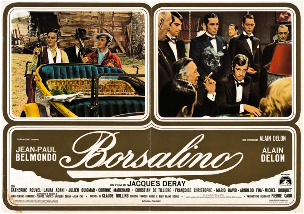 L'immagine digitale in oggetto è scansione della fotobusta originale del film Borsalino, elaborata in occasione della mostra "Riccardo Cucciolla - Ritratto d'Attore" organizzata nel 2012 dall'Associazione culturale “Attraverso lo Spettacolo”, dall'Assessorato al Mediterraneo, Cultura e Turismo della Regione Puglia e dal Servizio Biblioteca e Comunicazione Istituzionale del Consiglio Regionale della Puglia. L'opera, dai toni caldi e raffinati, è divisa in tre riquadri: due superiori che includono scene tratte dal film e una inferiore che mette insieme il titolo e i nomi degli attori. Il film, diretto da Jacques Deray e prodotto da Alain Delon, esce nelle sale italiane nel 1970. Tratta dal romanzo francese “Bandits à Marseille” di Eugène Saccomanno, la pellicola, ambienta...