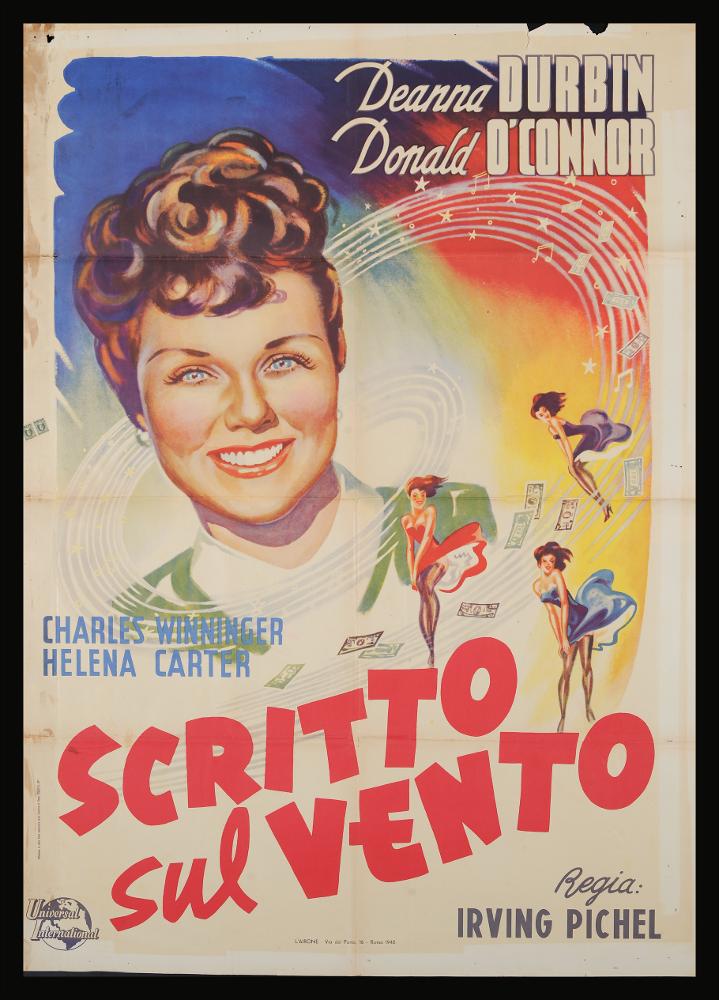 L'immagine riproduce uno dei manifesti conservati presso la Mediateca Regionale Pugliese (vedi Note). Si tratta di uno dei manifesti del film in bianco e nero “Scritto sul vento” del 1947 per la regia di Irving Pichel. La composizione non presenta firma ma si inserisce pienamente nella scuola italiana di cartellonisti degli inizi degli anni Cinquanta. Centrale il grande e sorridente ritratto della bellissima Deanna Durbin , interprete qui di una cantante, da notare infatti il pentagramma che la circonda a mo’ di spirale con note, stelle luminose e  denaro sulle righe. Colpisce la presenza di tre donne che poggiano rispettivamente su due lettere sul pentagramma, immortalate mentre il vento, esplicitato nel titolo, fa muovere le loro gonne....