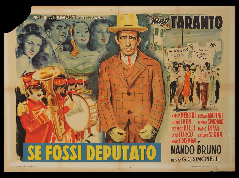 L'immagine riproduce uno dei manifesti conservati presso la Mediateca Regionale Pugliese (vedi Note). Si tratta di una delle versioni grafiche per il manifesto de "Se fossi deputato", film comico italiano del 1949, a firma del pittore Rinaldo Gèleng. Artista poliedrico ed eclettico, dopo gli studi d'arte, visse e lavorò per molti anni a Parigi, poi a Milano dove realizzò una serie di copertine per Mondadori e infine a Roma, dove realizzò alcuni manifesti per i film di Fellini. Il suo stile fresco e pittorico è fatto di pennellate liquide e sfumate, con spunti grafici originali, composizioni personali, in cui rivela la sua dote di ritrattista. Per questo manifesto orizzontale, l'artista immagina una composizione corale, vivace, ricca di dettagli narrativi e colori caldi....