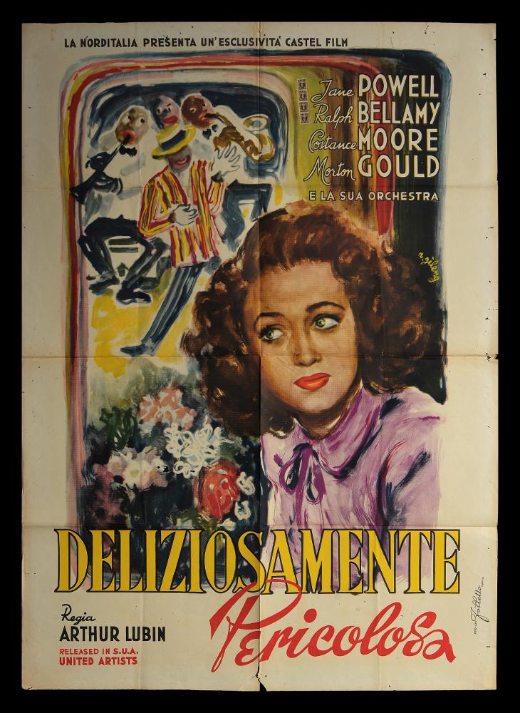 L'immagine riproduce uno dei manifesti conservati presso la Mediateca Regionale Pugliese (vedi Note). Si tratta di uno dei manifesti del film in bianco e nero “Deliziosamente pericolosa” del 1945 per la regia di Arthur Lubin. La firma che si legge è dell’illustratore romano Rinaldo Gèleng. Artista poliedrico ed eclettico, dopo gli studi d'arte, visse e lavorò per molti anni a Parigi, poi a Milano dove realizzò una serie di copertine per Mondadori e infine a Roma, dove creò alcuni manifesti per i film di Fellini. Il suo stile fresco e pittorico è fatto di pennellate liquide e sfumate, con spunti grafici originali, composizioni personali, in cui rivela la sua dote di ritrattista come si può notare anche in questo suo lavoro. Il volto della bellissima Jane Powell è partico...