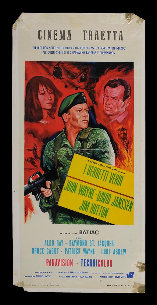 L'immagine riproduce uno dei manifesti conservati presso la Mediateca Regionale Pugliese (vedi Note). Si tratta della locandina del film "I berretti verdi", la cui composizione è a firma di Ferrini. L'illustratore e grafico Renato Ferrini realizza una scena pittorica dal forte impatto scenico, grazie anche all'uso dei colori concentrati principalmente sul rosso e il verde, che enfatizzano il richiamo al genere di guerra ed esaltano i volti dei protagonisti, ricchi di drammaticità e pathos. Ferrini, che a Roma inizia la sua carriera per la notevole e fortunata produzione di bozzetti per francobolli emessi da Poste Italiane, è noto per la sua tecnica curata nei dettagli e per le sue composizioni in cui molto spesso è la grafica moderna a farla da padrone....