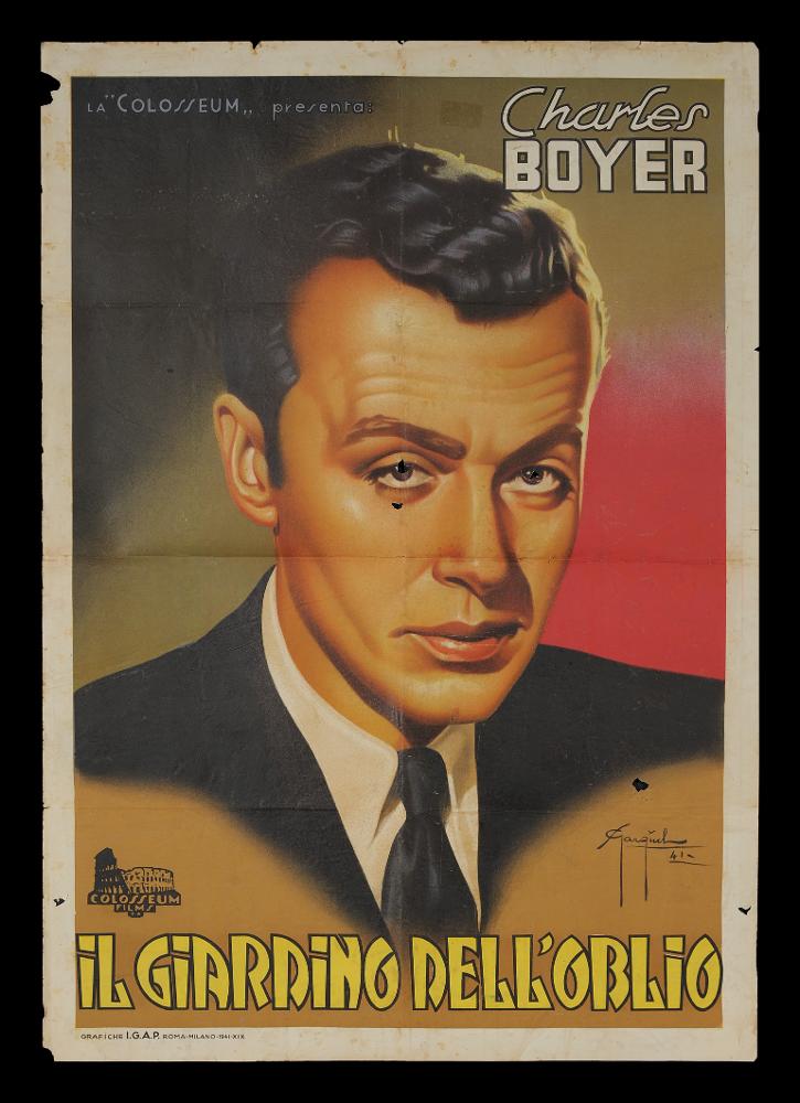 L'immagine riproduce uno dei manifesti conservati presso la Mediateca Regionale Pugliese (vedi Note). Si tratta di uno dei manifesti del film “Il Giardino di Allah” del 1936 per la regia di Richard Boleslawski. La firma che si legge è dell’illustratore Gargiulo (Sergio Gargiulo), riconoscibile per gli allungamenti delle aste discendenti delle “g” e l’indicazione della data. Unico soggetto della composizione grafica è il grande ritratto molto realista di Charles Boyer, nei panni di un ex monaco trappista. Particolare l’uso dei colori sullo sfondo, in prevalenza il sabbia in diverse sfumature e una parte rossa che sembra evocare un sole al tramonto....