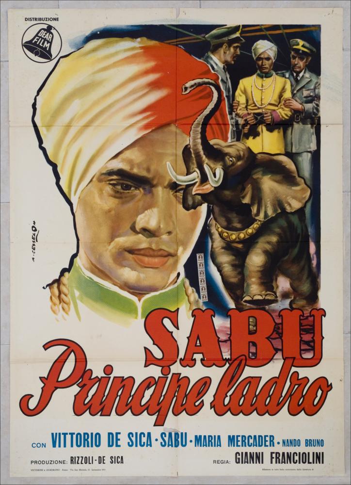 L'immagine riproduce uno dei manifesti conservati presso la Mediateca Regionale Pugliese, esaminati in "Cinema al muro: Angelo Cesselon" (vedi Note). Il giallo dell'elegante vestito in raso del principe indiano risalta sullo sfondo e richiama il volto a tutto campo del sultano, dallo sguardo fisso e pensieroso. Un piccolo elefante completa la scena. Il colore rosso, tanto caro a Cesselon, ritorna in questo manifesto, in parte accennato sul turbante del principe, ma soprattutto sulla scritta, del titolo del film e che campeggia a grandi caratteri nella fascia medio-inferiore del manifesto, del quale occupa una parte essenziale. I nomi degli attori sono riportati in colore blu e tra questi predomina quello del grande De Sica....