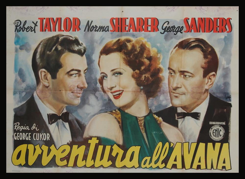 L'immagine riproduce uno dei manifesti conservati presso la Mediateca Regionale Pugliese (vedi Note). Si tratta di una delle versioni grafiche per il manifesto del film in bianco e nero "Avventura all’Avana" del 1942 per la regia di George Cukor. L’illustrazione è a firma di Carloantonio Longi (Longi) come si evince dalla firma sul lato a destra, pittore ed illustratore poliedrico che molto si ispirò ad Anselmo Ballester. Tra i cartellonisti più produttivi del Novecento, Longi ha sperimentato nella sua carriera diversi stili, dallo sfumato più classico degli anni Trenta, fino agli stili più contemporanei e lineari. Il forte realismo dei volti è una caratteristica del pittore, che iniziò la carriera artistica proprio come ritrattista e solo in seguito si dedicò all'attiv...
